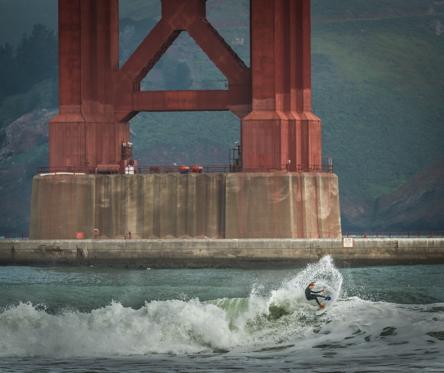 Surfing underneath the iconic Golden Gate Bridge is a picturesque experience for those able to catch a wave.