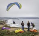 The cliffs of Pacifica, CA, are a popular spot for hang gliding.  A windy day in July, 2018.