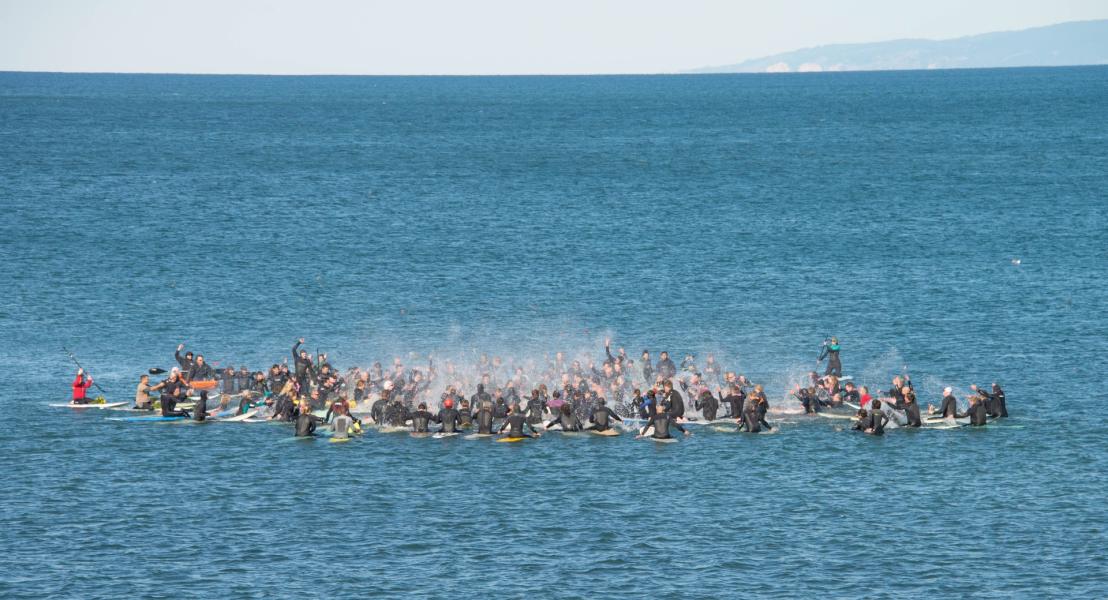 Pacifica surfers pay tribute to fallen friend Kenny Jones,  in a traditional paddle-out ceremony, 28 November 2015