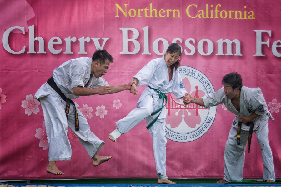 A Female Karate expert defends herself against two bad guys at the 52nd Annual Cherry Blossom Festival in San Francisco, April 13th, 2019