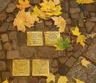 The Stolpersteine project begun in 1992 by Gunter Demnig, places plaques in sidewalks in German cities near the victim's last known residence.  Over 70,000 have been placed.