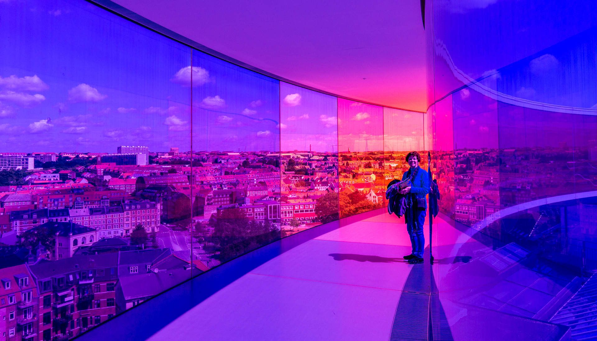 The Rainbow Panorama walkway atop the art museum in Aarhus, Denmark. Sunlight through the colored glass panes makes really bright colors.
