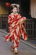 Apprentice Geisha hurrying off to her engagement, Kyoto, Japan