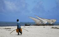Fisherman taking fuel to his boat Zanzibar