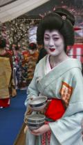 Geisha Collecting Tea Bowls after Serving Tea, Kitanotemangu, Kyoto, Japan